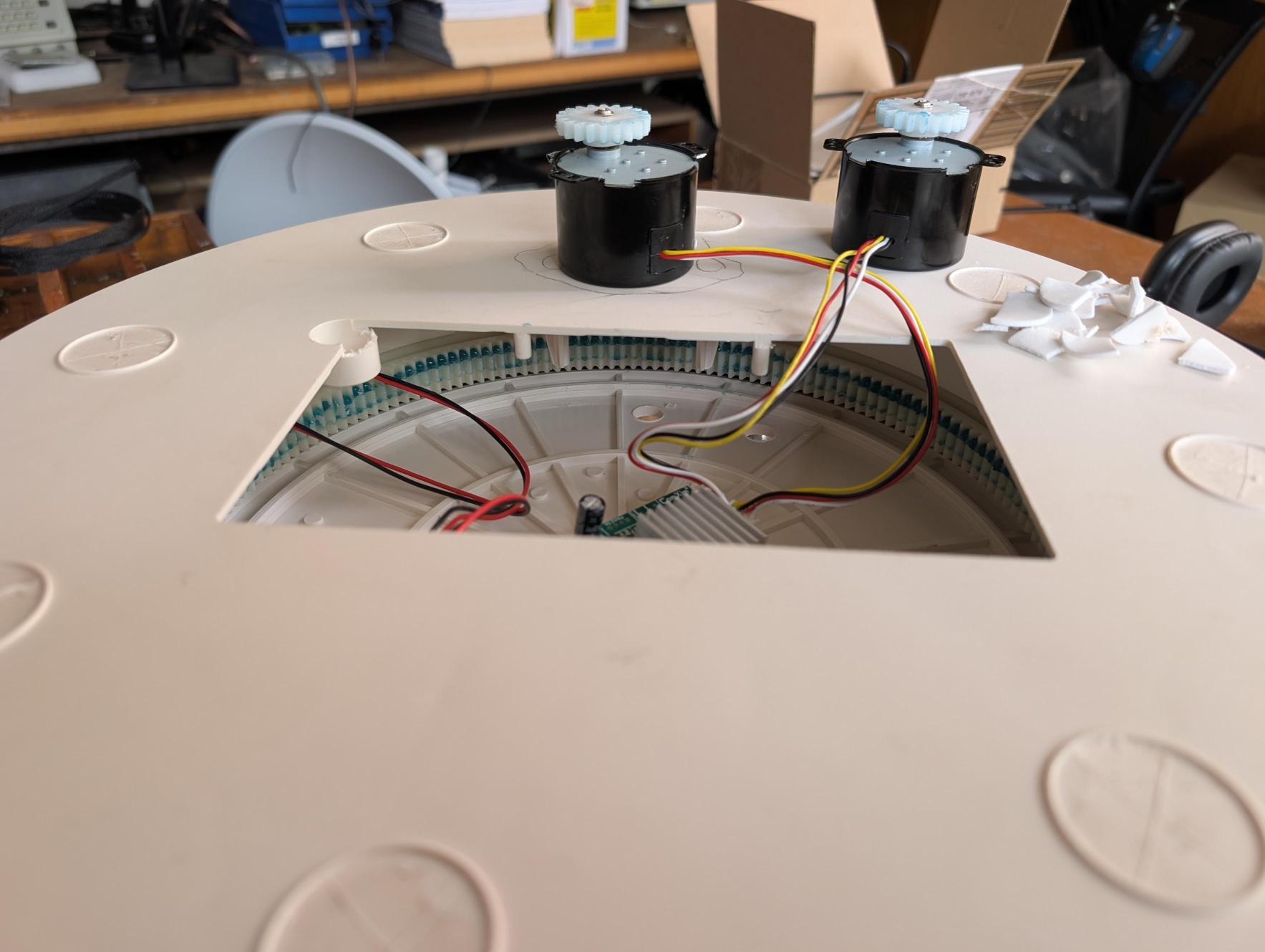 June 23: Both 50BYJ46-20 stepper motors sitting above the access window with their pinion gears engaging the ring gear below.